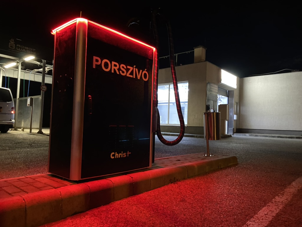 young man wearing shades and a hat with a beard, tattos and ear piercings